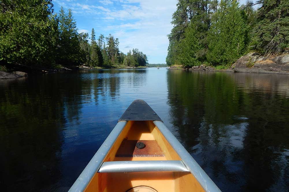 A canoe in the beautiful waters of the BWCAW